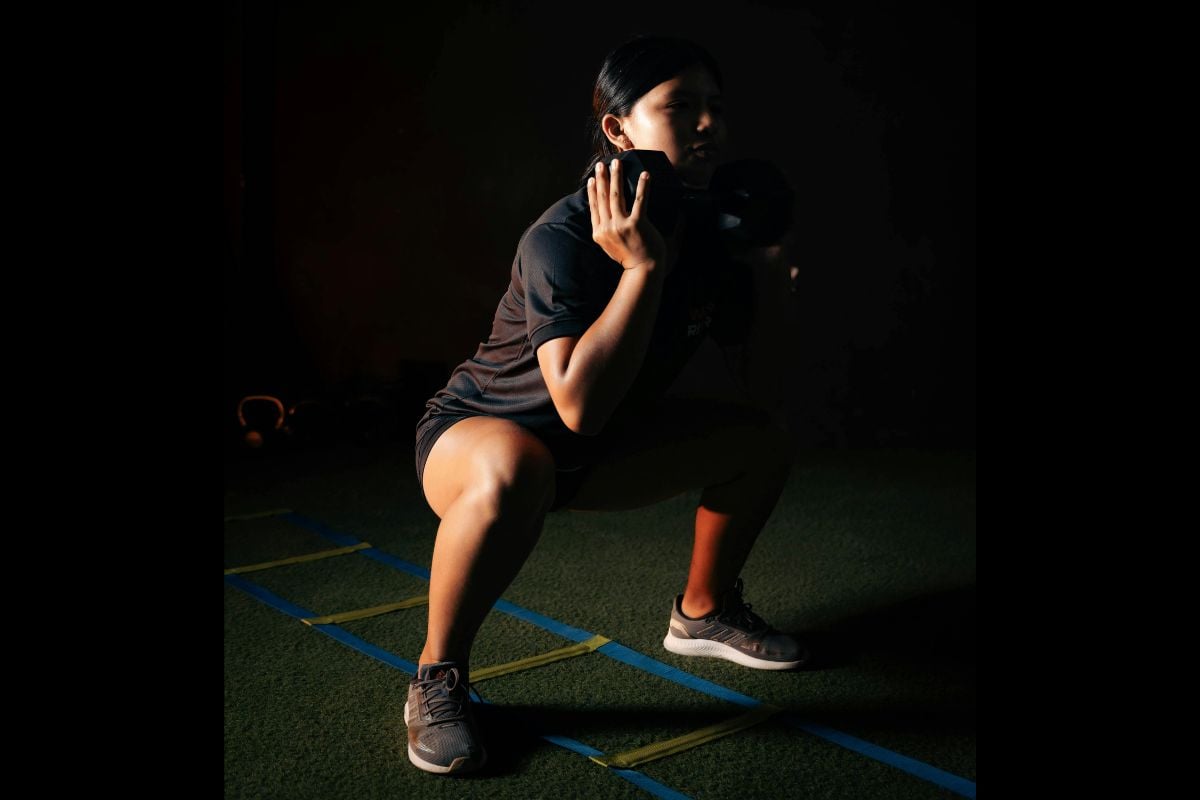Dumbbell Sumo Squat, an inner thigh dumbbell exercise